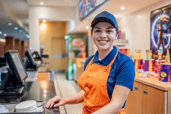 Female Restaurant cashier smiling